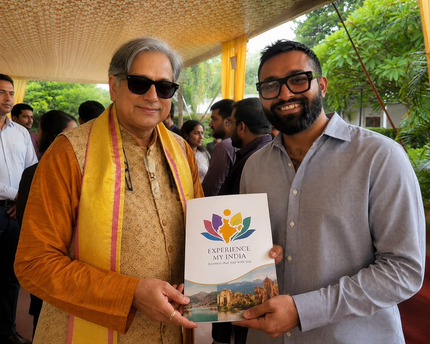 Gurudutt, Founder of Experience My India, holding the company journey book